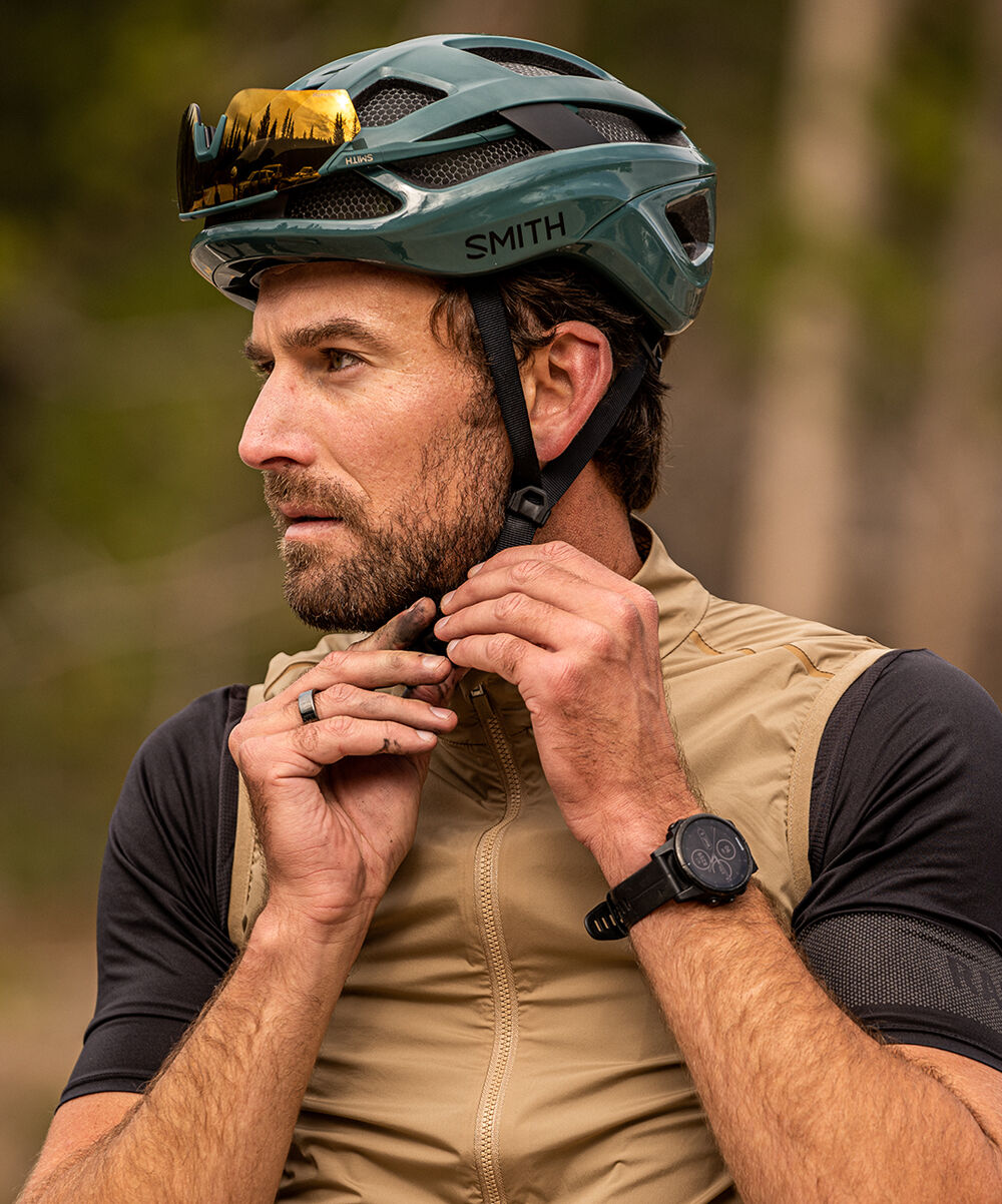 Man putting on bike helmet Man putting on bike helmet