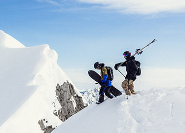 Skiers on mountain top