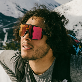 Man wearing sunglasses while ski touring